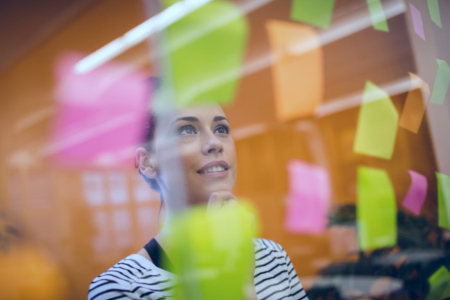 process owner uses sticky notes to map out the business processes